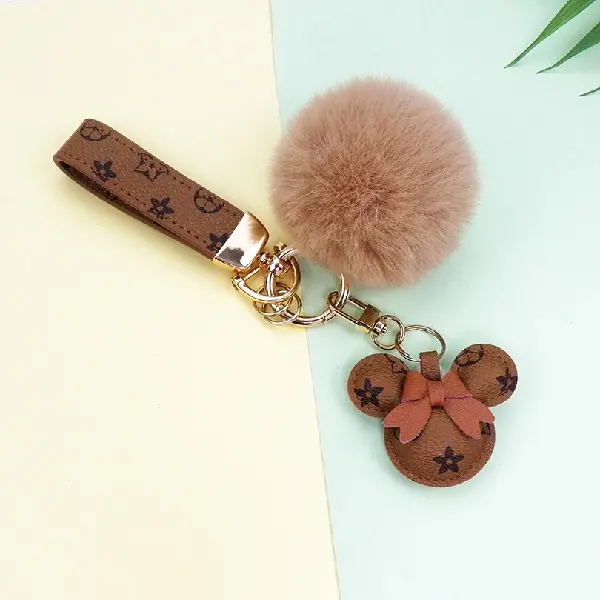 Yellow flower + keychain + hair ball,chaincharmsupply.com
