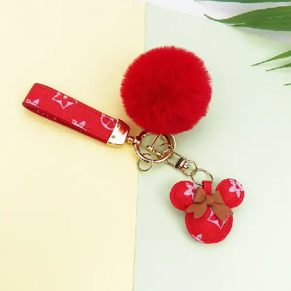 Red flower + key chain + fur ball,chaincharmsupply.com
