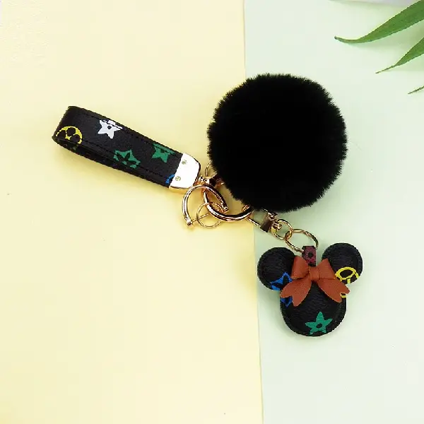 Black flower + key chain + fur ball,chaincharmsupply.com