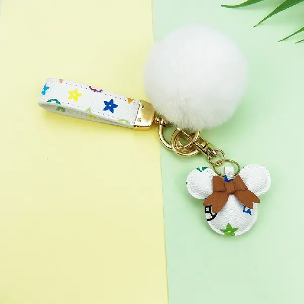 White flower + keychain + hair ball,chaincharmsupply.com