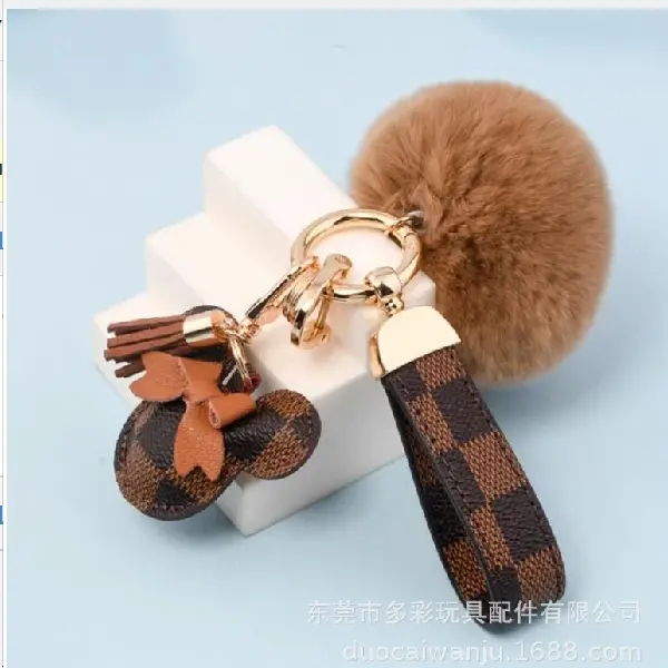 Brown grid + fur ball + key chain + tassel,chaincharmsupply.com