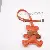 Wholesale Creative Station Bear Bag Charms - Trendy PU Leather - Orange color