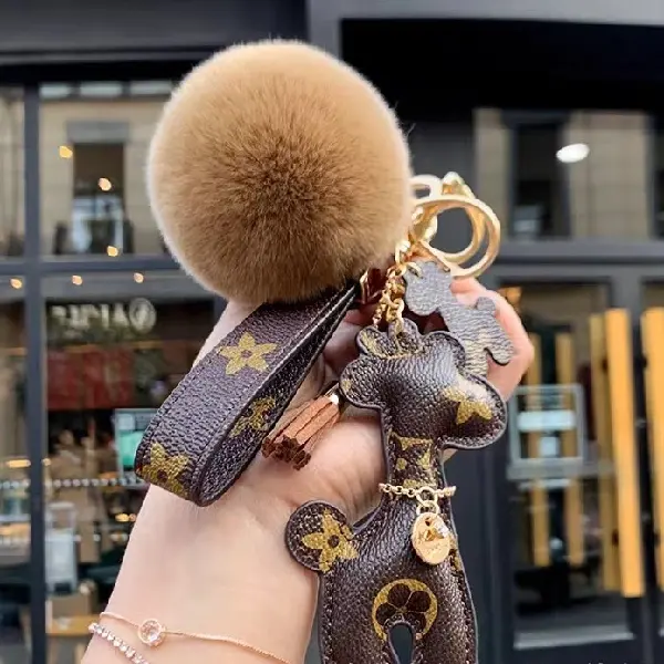 Brown flower+ keychain + hair ball,chaincharmsupply.com