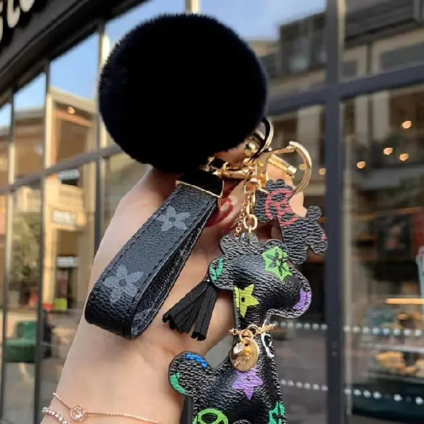 Black flower + key chain + fur ball,chaincharmsupply.com