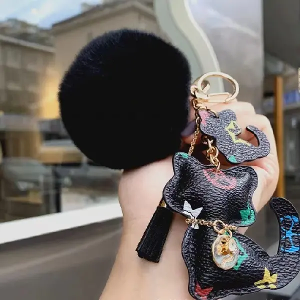 Black flower + fur ball,chaincharmsupply.com