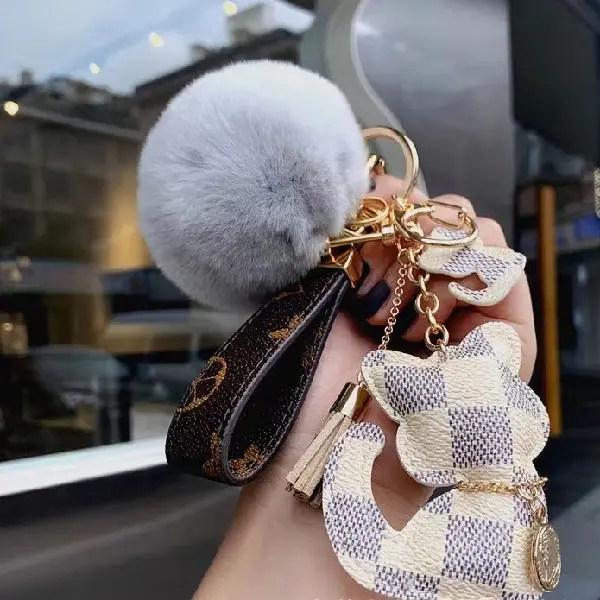 White grid + keychain + hair ball,chaincharmsupply.com