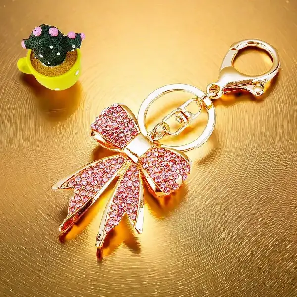 A573 full Rhinestone bow pink-single OPP bag packaging,chaincharmsupply.com