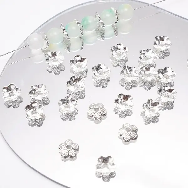 17 models, 9mm, aperture about 1mm, silver, 20 pcs/pack,chaincharmsupply.com
