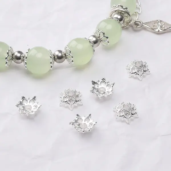 30 models, 7mm, aperture about 1mm, silver, 50 pcs/pack,chaincharmsupply.com