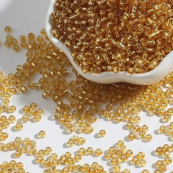 Golden yellow-3mm aperture 0.8mm 15g/pack about 500 pieces,chaincharmsupply.com