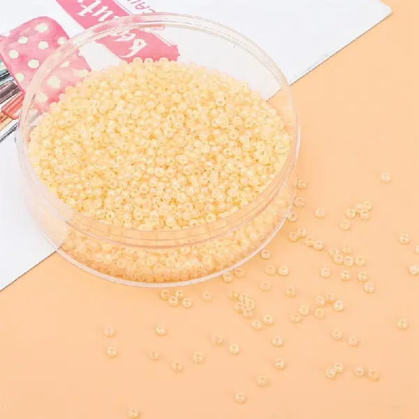 Light yellow-3mm hole diameter about 0.8mm 10g/pack about 220 pieces,chaincharmsupply.com