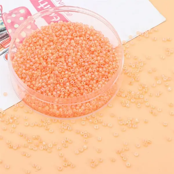 Orange-2mm, hole diameter about 0.8mm, 10g/pack, about 660 pieces,chaincharmsupply.com