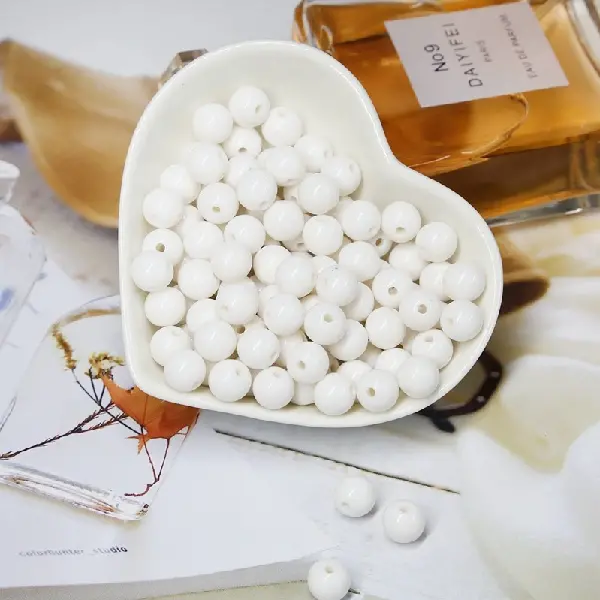 White - diameter 10mm, hole diameter 2mm, about 50 pieces/pack,chaincharmsupply.com